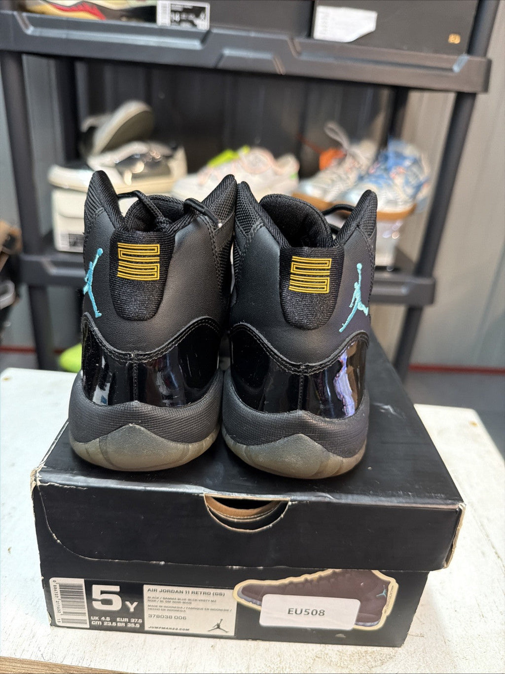 Air Jordan 11 Retro Gamma Blue Sneakers Black Patent in Leather - product image from the listing.