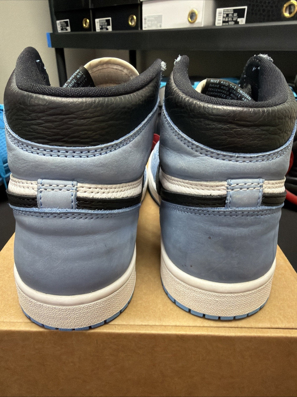 pair of Nike Air Jordan 1 Retro High OG Trainers in the "University Blue 6.5y - product image from the listing.