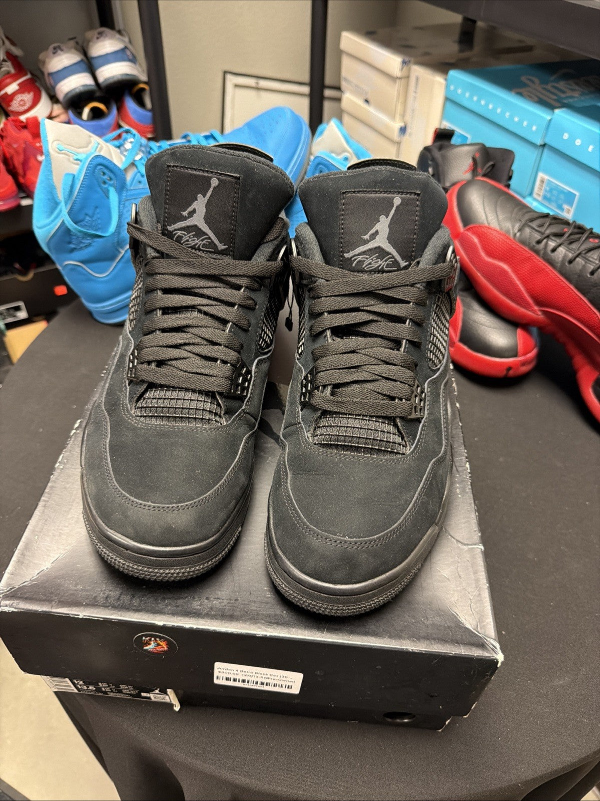 Jordan 4 Retro Mid Black Cat - Size 12 - product image from the listing.