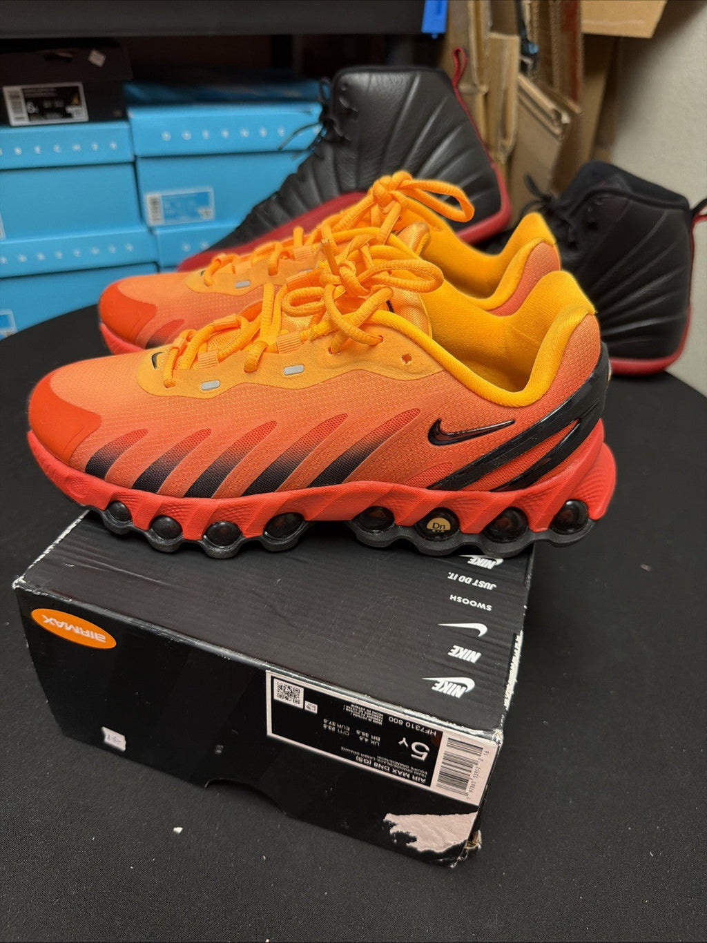 (GS) HF7310 800 Laser Orange Black Youth Athletic Shneakers - Nike Air Max Dn8 - product image from the listing.