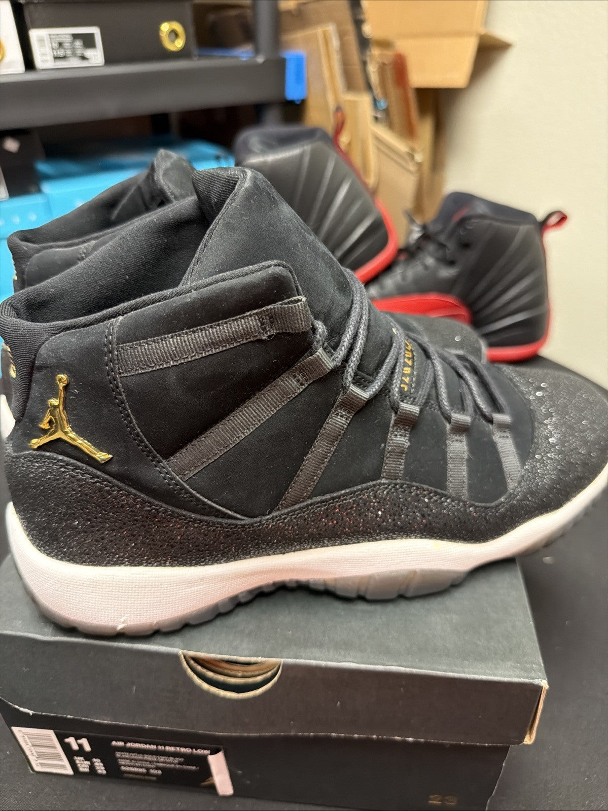 Women's Air Jordan 11 Retro GS Heiress Size 10Y / 11.5 2017 Black Gold 852625-030 - product image from the listing.
