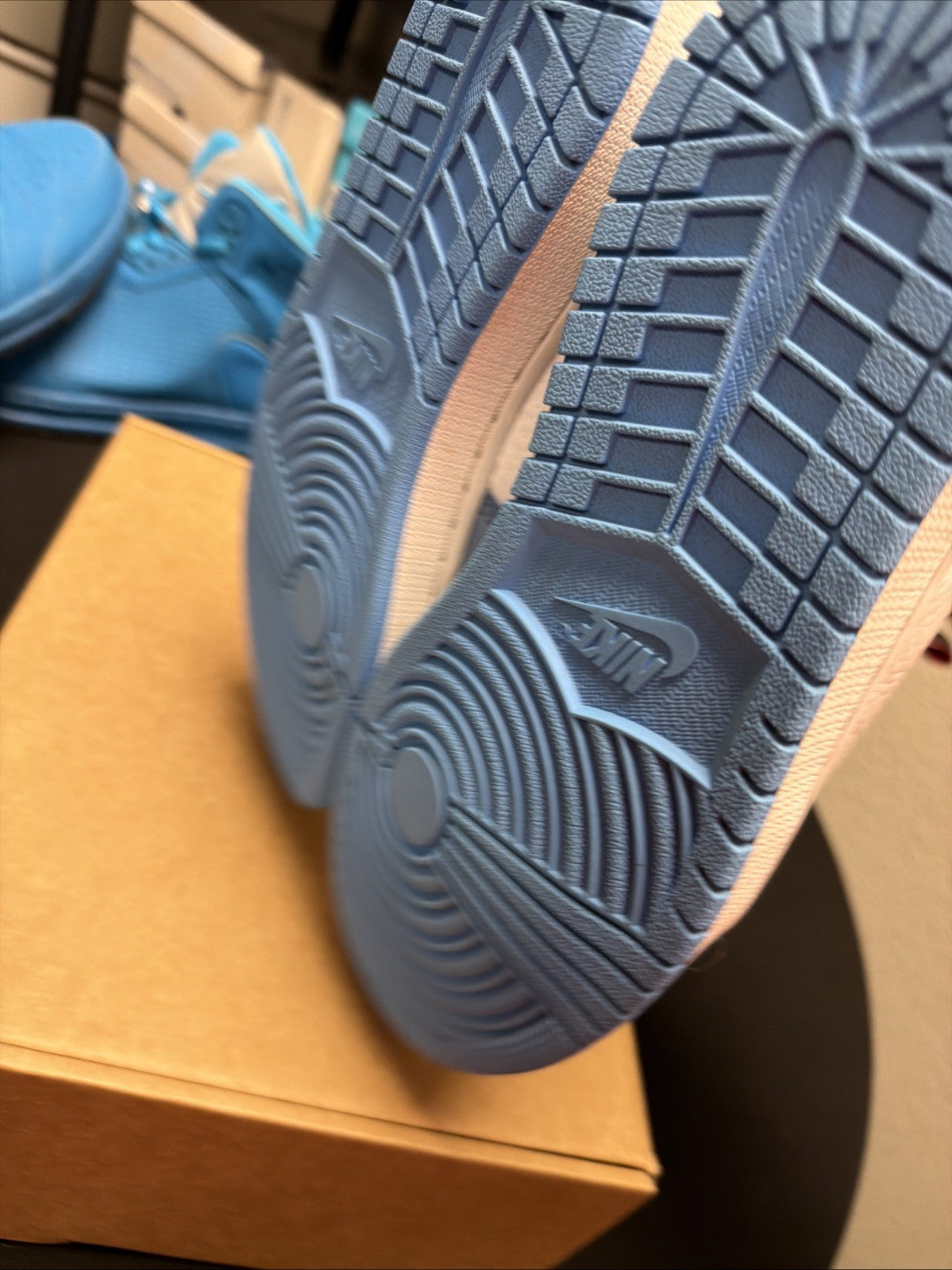 pair of Nike Air Jordan 1 Retro High OG Trainers in the "University Blue 6.5y - product image from the listing.