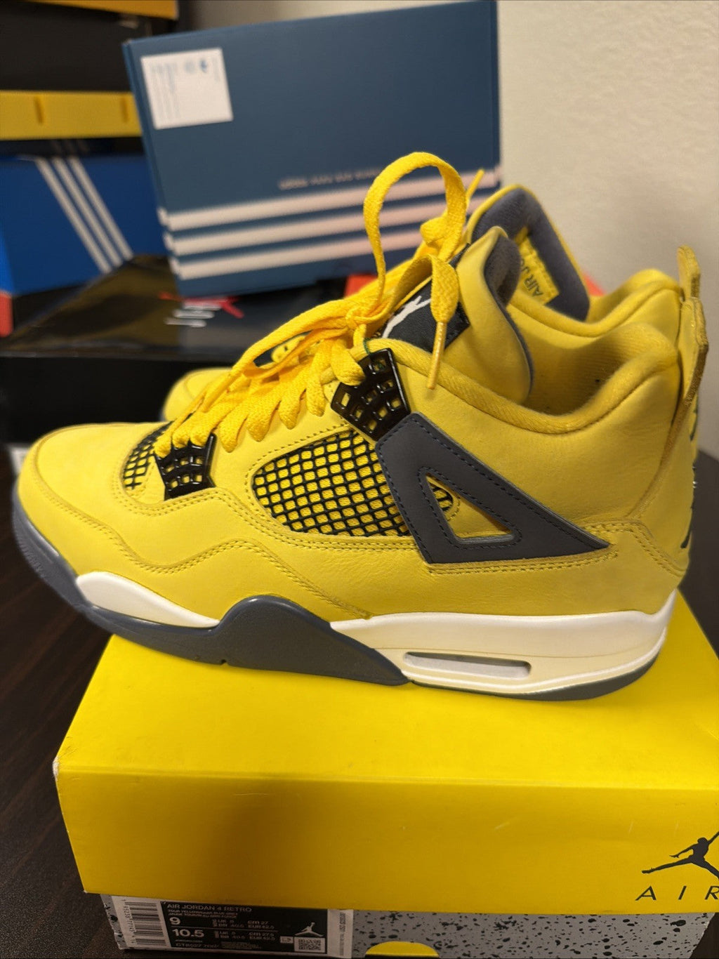 Air Jordan 4 Retro Tour Yellow/Dark in Blue Grey - product image from the listing.