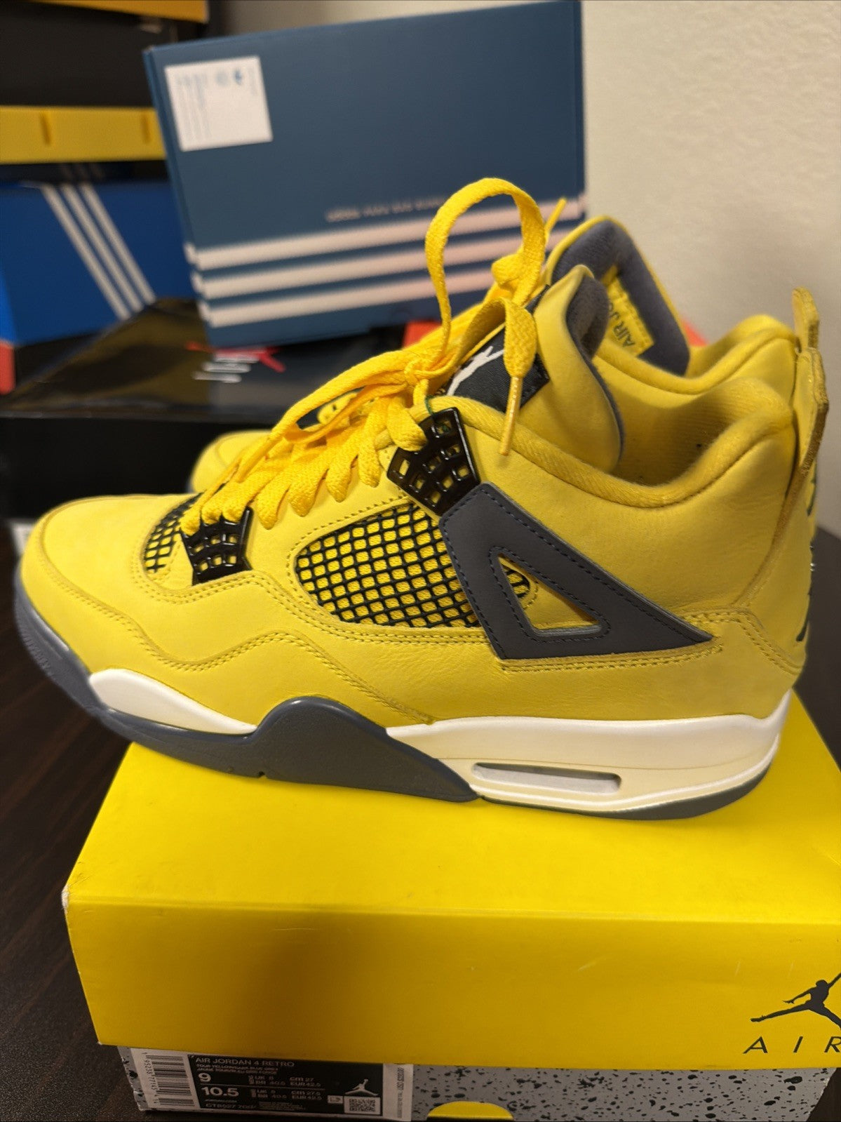Air Jordan 4 Retro Tour Yellow/Dark in Blue Grey - product image from the listing.