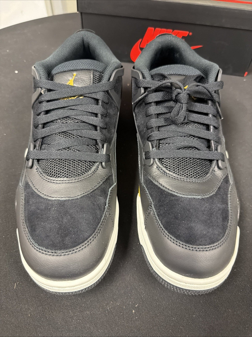 Men's Air Jordan 4 RM Shoes (Black/Sail/Team Gold/Metallic Gold) - product image from the listing.