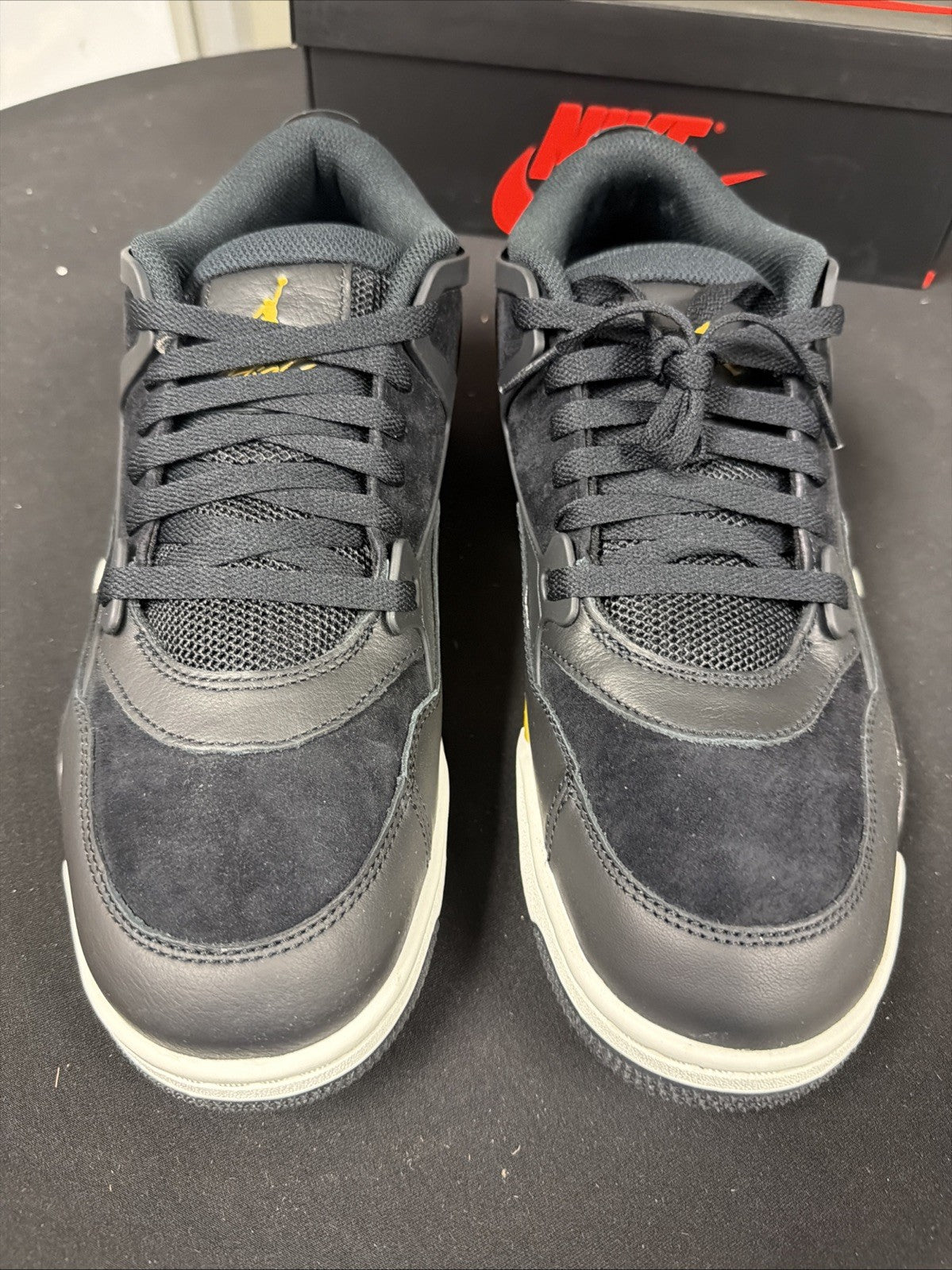 Men's Air Jordan 4 RM Shoes (Black/Sail/Team Gold/Metallic Gold) - product image from the listing.