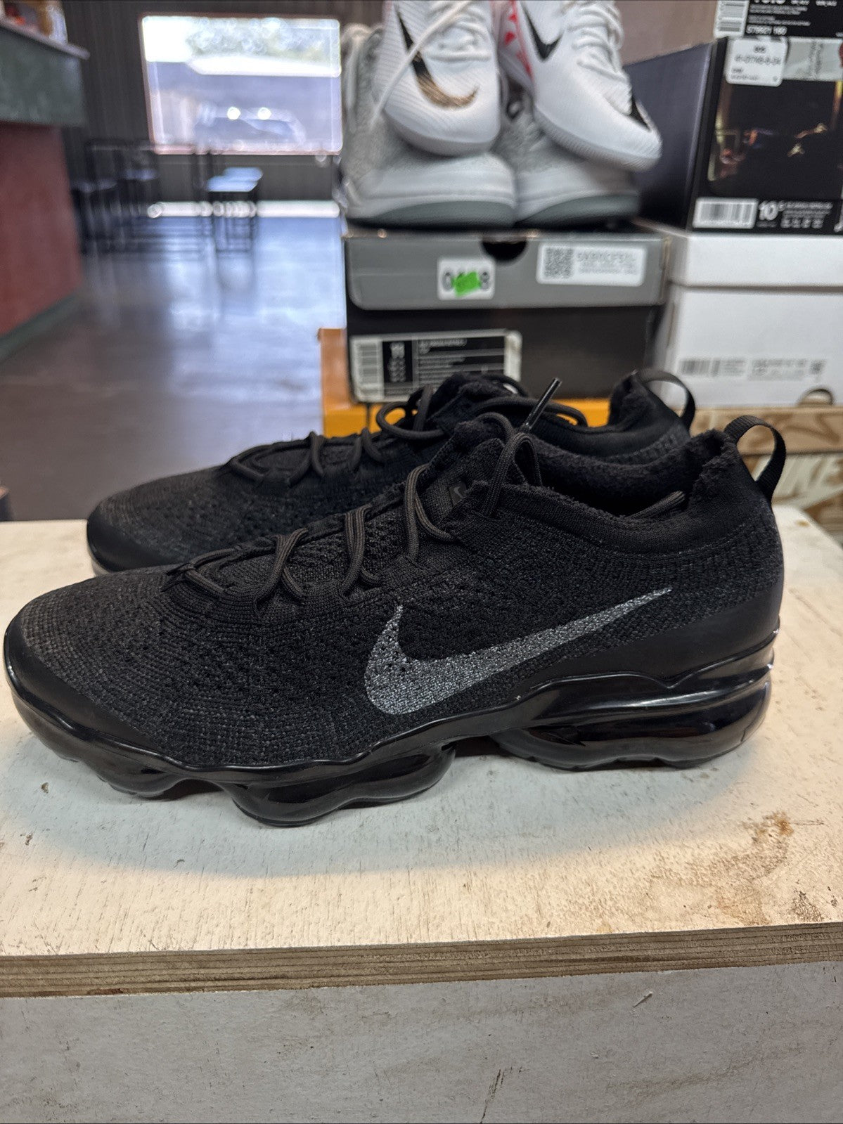 Size 10.5 - Nike Air Vapormax Flyknit Triple Black | Replacement Box for Women - product image from the listing.