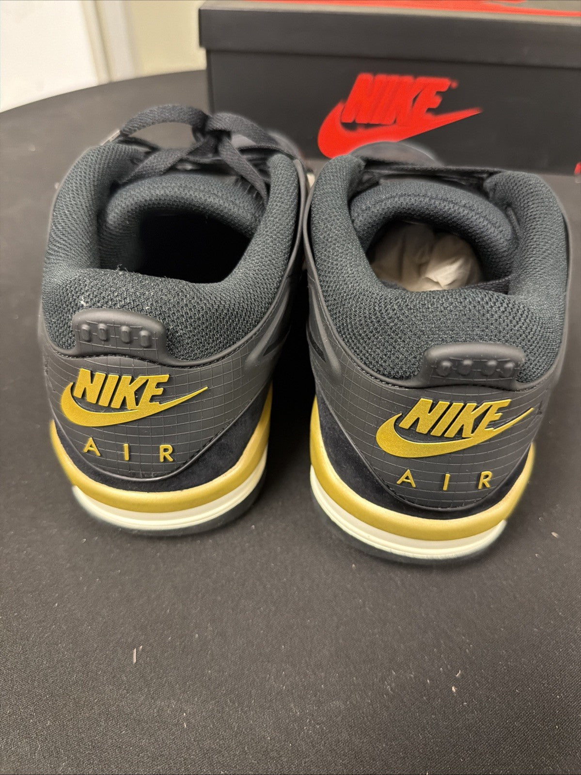 Men's Air Jordan 4 RM Shoes (Black/Sail/Team Gold/Metallic Gold) - product image from the listing.