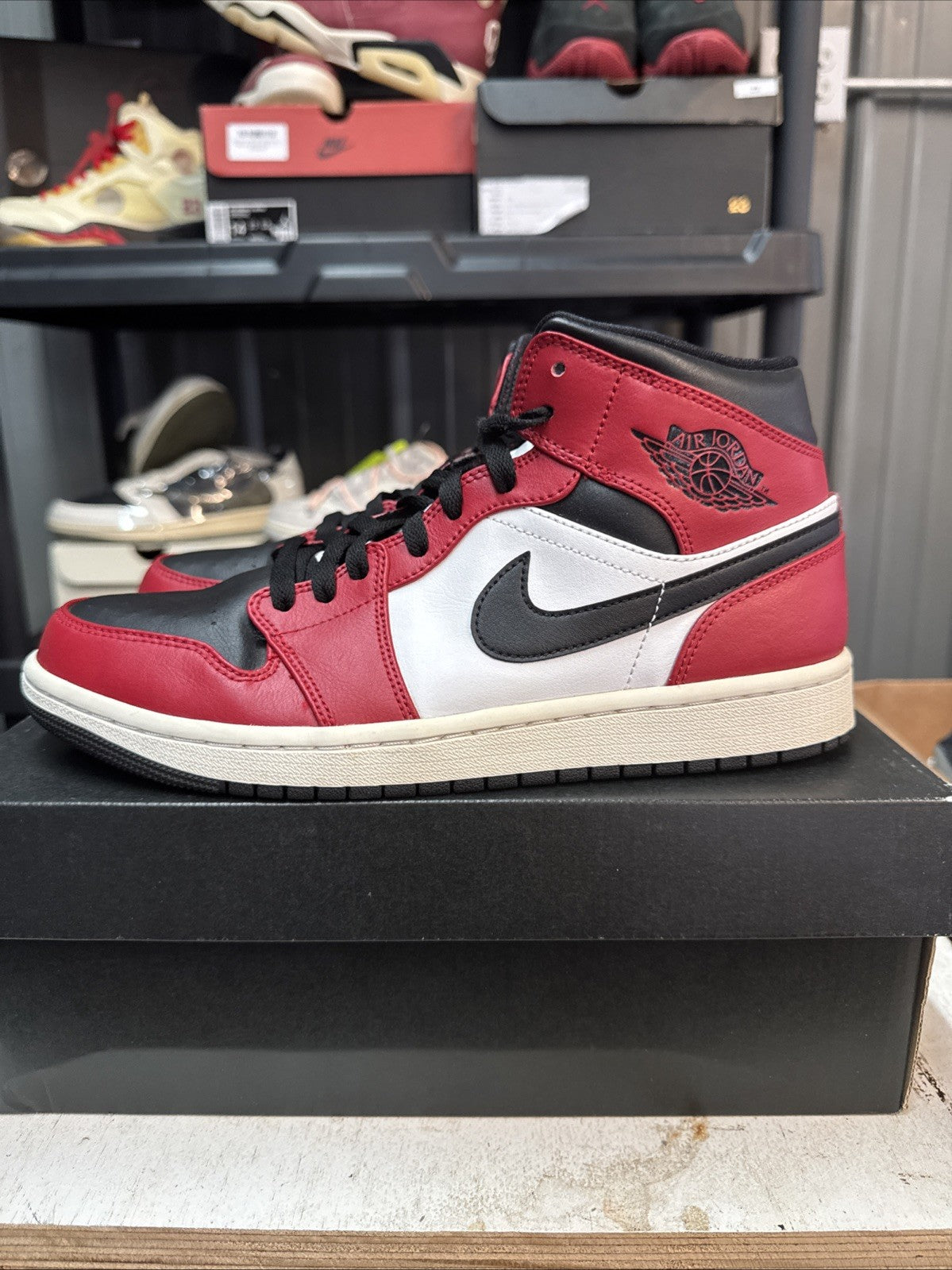 - Red, Black & White Chicago Size 9 MJ - Nike Air Jordan 1 Mid - product image from the listing.