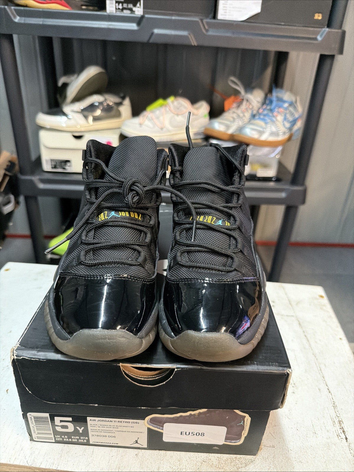 Air Jordan 11 Retro Gamma Blue Sneakers Black Patent in Leather - product image from the listing.
