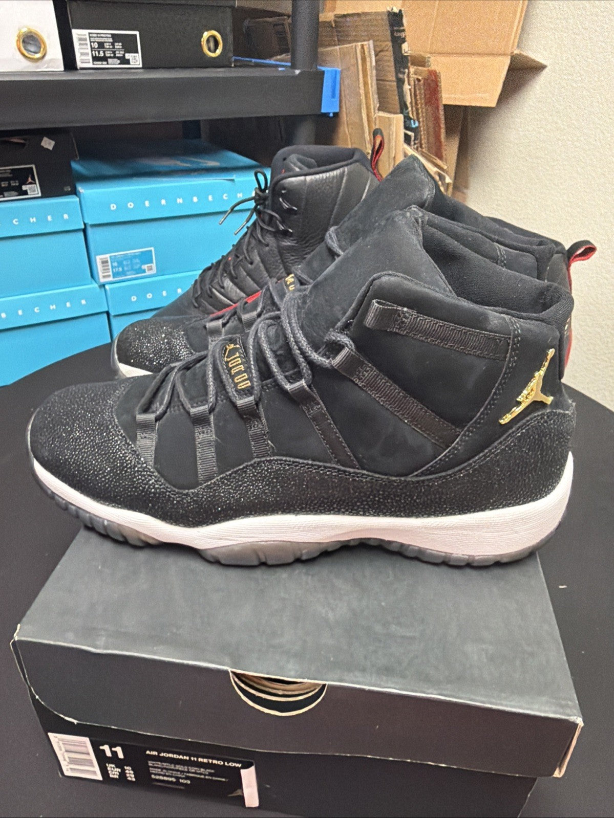 Women's Air Jordan 11 Retro GS Heiress Size 10Y / 11.5 2017 Black Gold 852625-030 - product image from the listing.