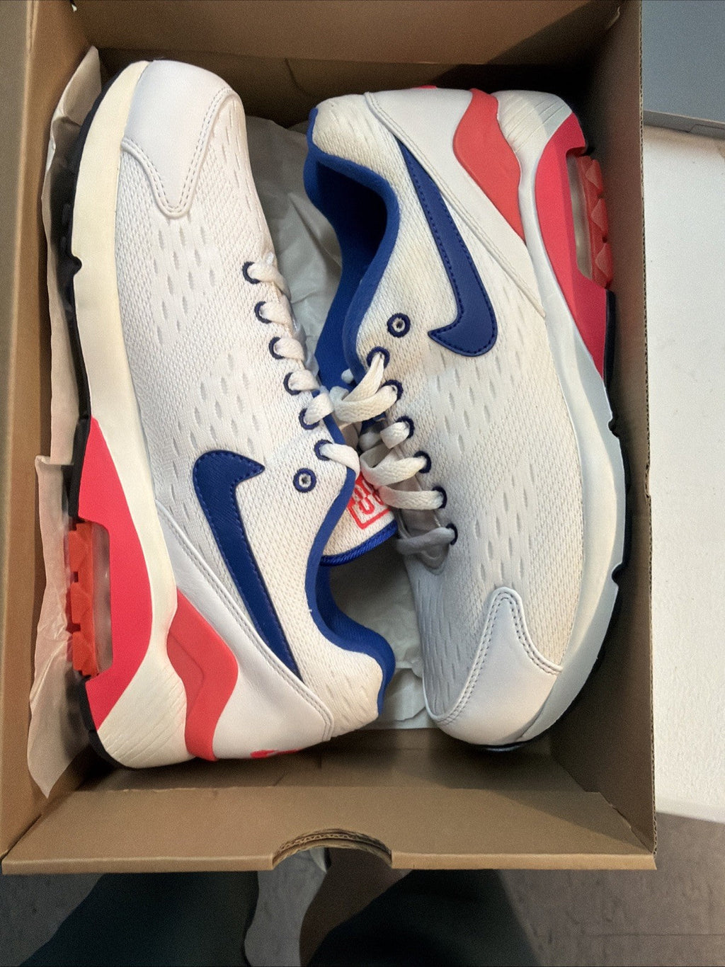 Size 10.5 Nike Air Max 180 EM White Solar in Red - product image from the listing.