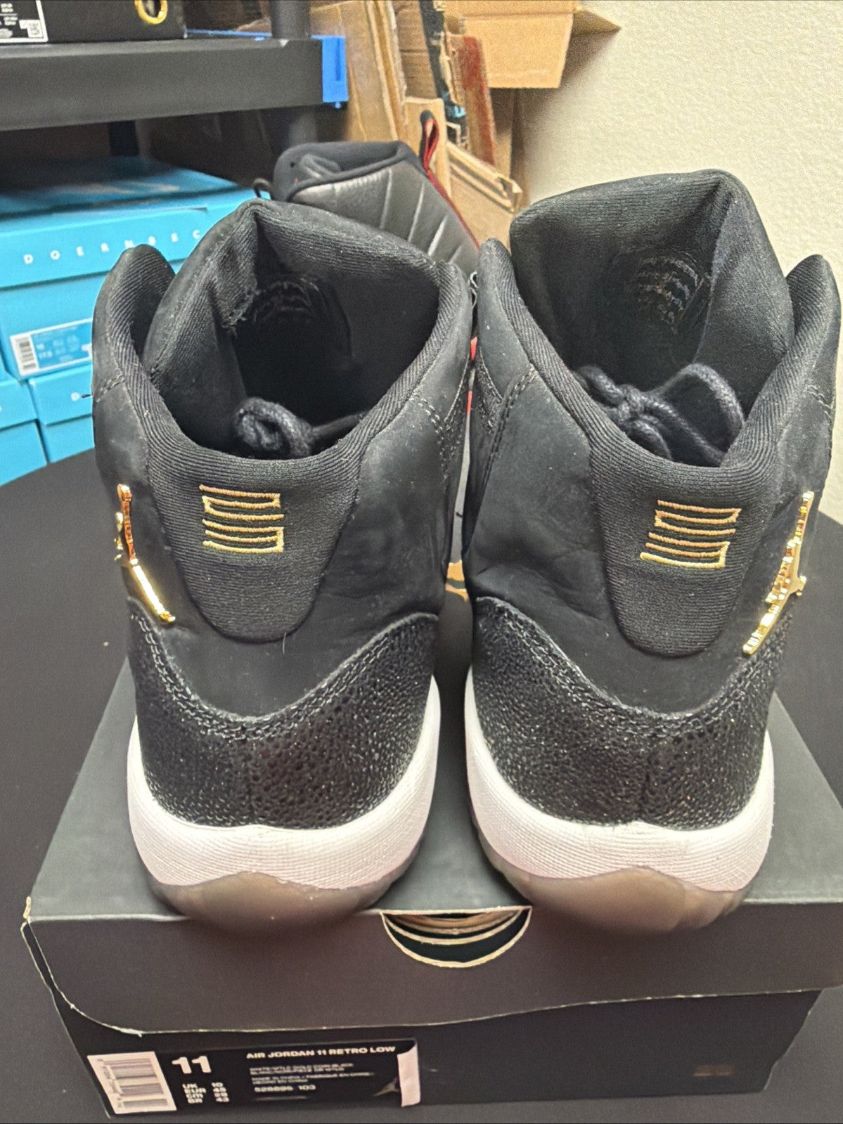 Women's Air Jordan 11 Retro GS Heiress Size 10Y / 11.5 2017 Black Gold 852625-030 - product image from the listing.