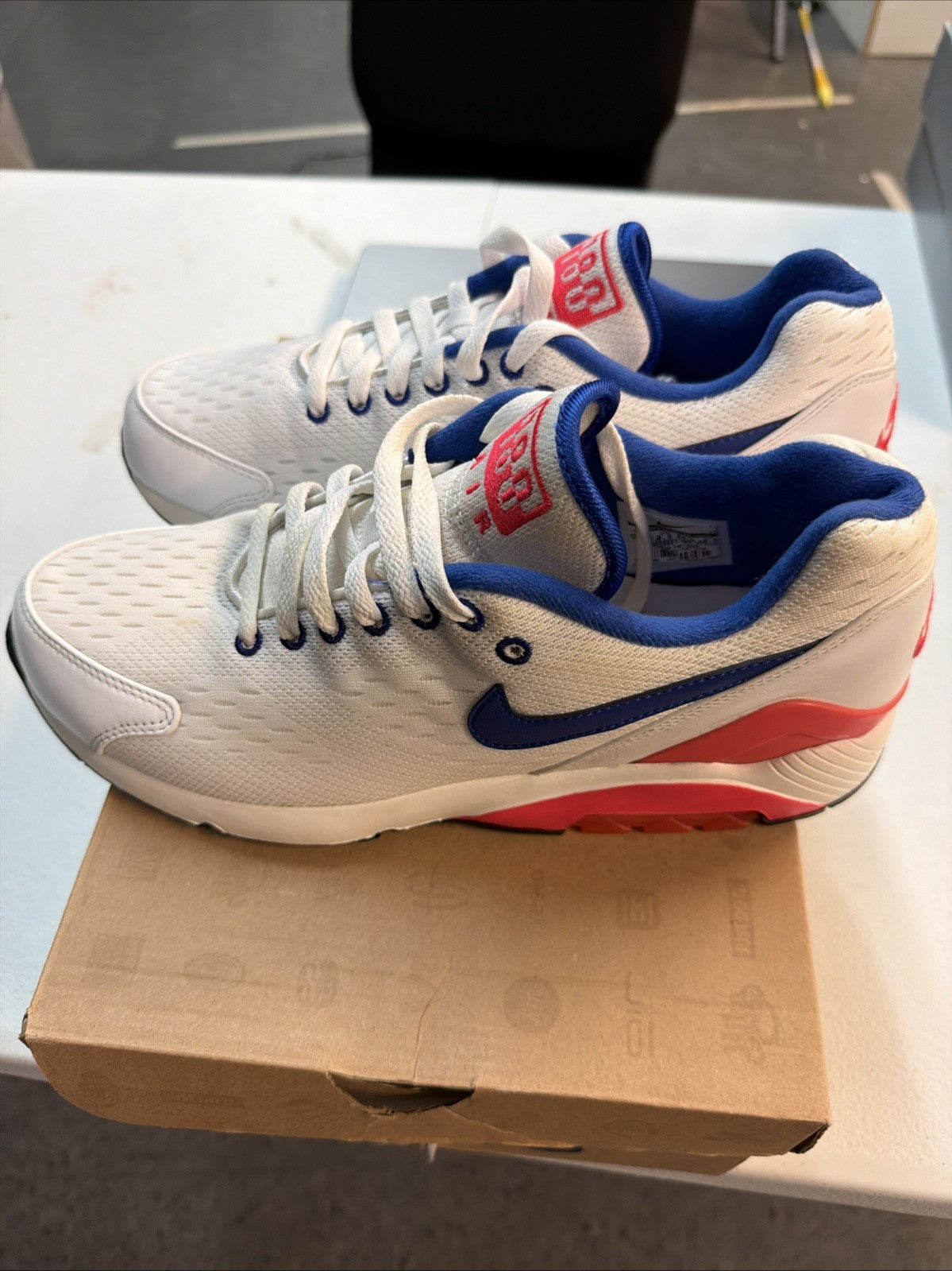 Size 10.5 Nike Air Max 180 EM White Solar in Red - product image from the listing.