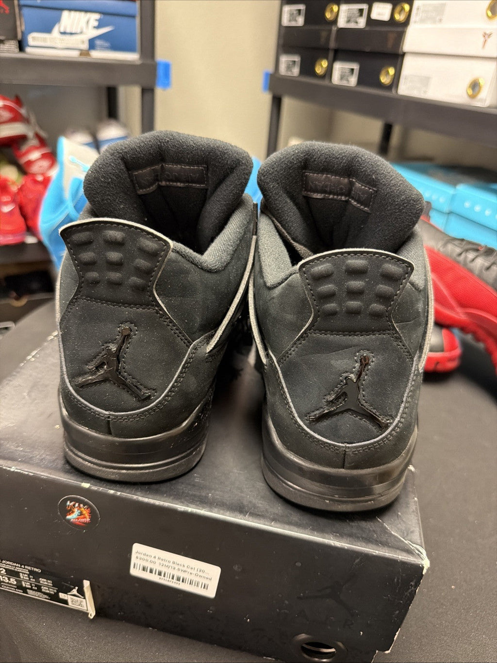 Jordan 4 Retro Mid Black Cat - Size 12 - product image from the listing.