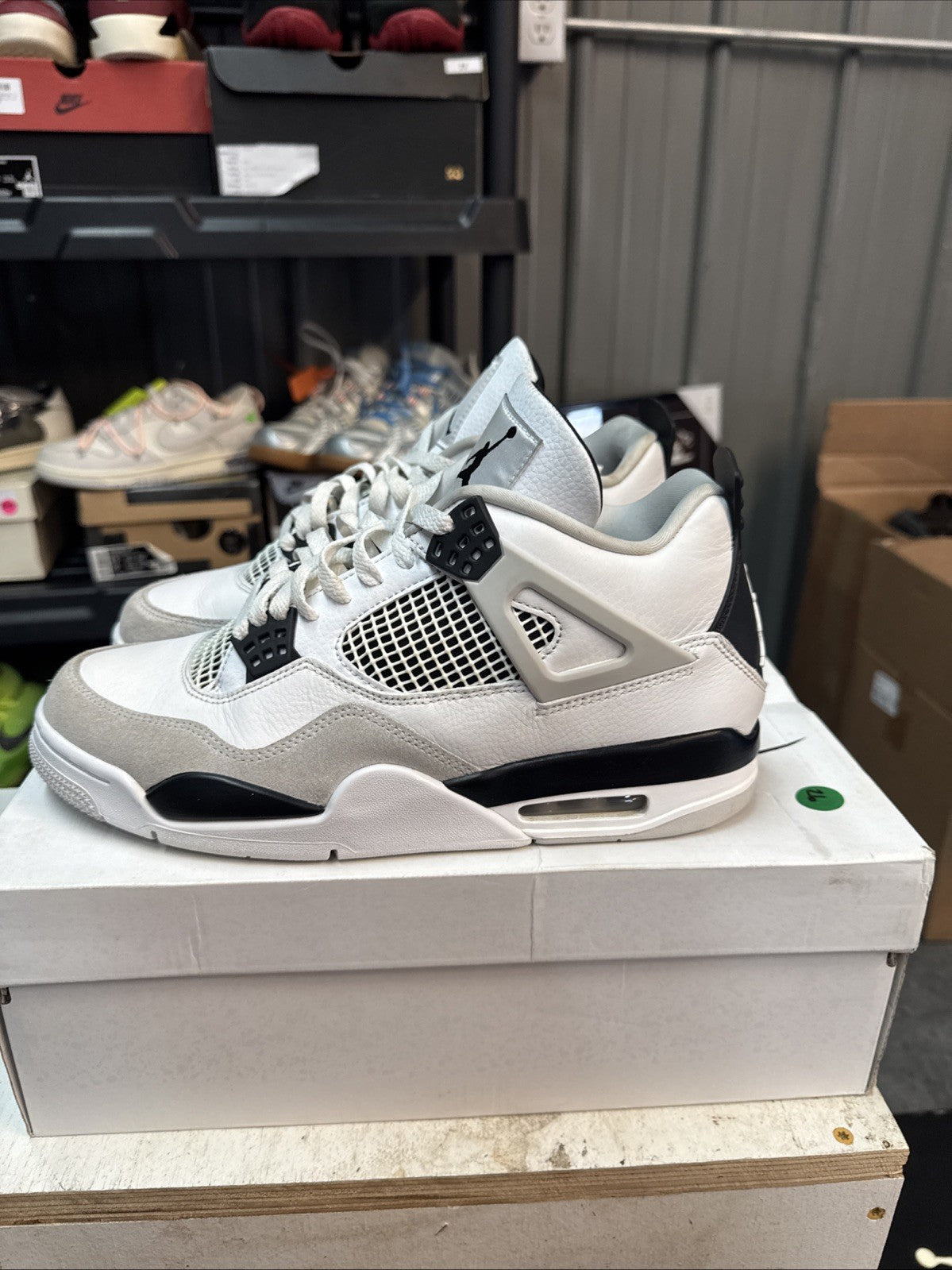"Military Black" Size 10 - Jordan 4 Retro White and Black - product image from the listing.