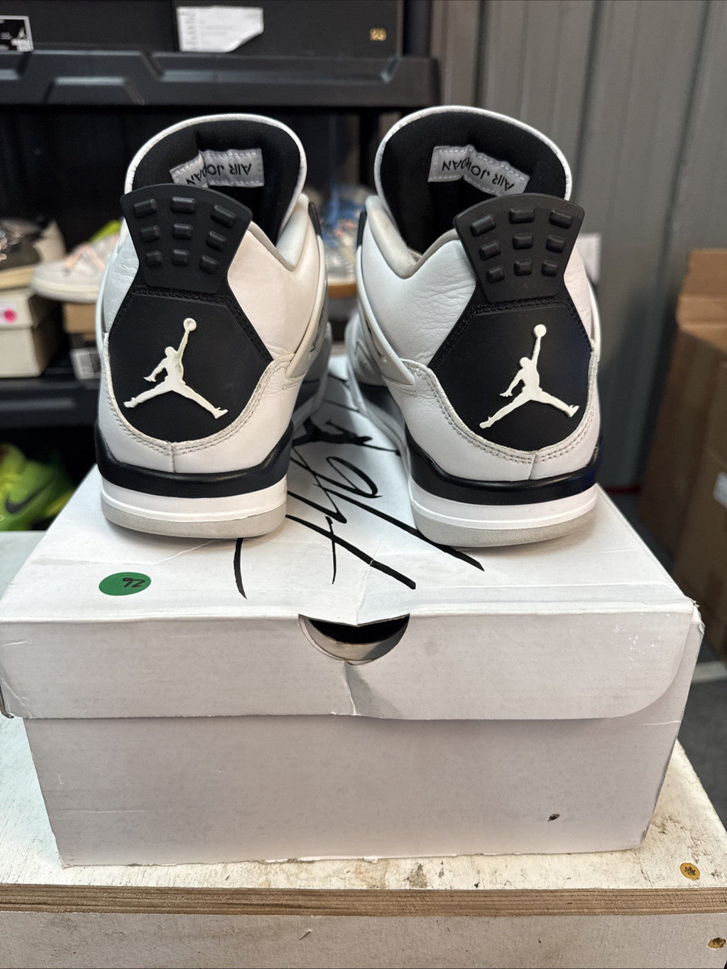 "Military Black" Size 10 - Jordan 4 Retro White and Black - product image from the listing.