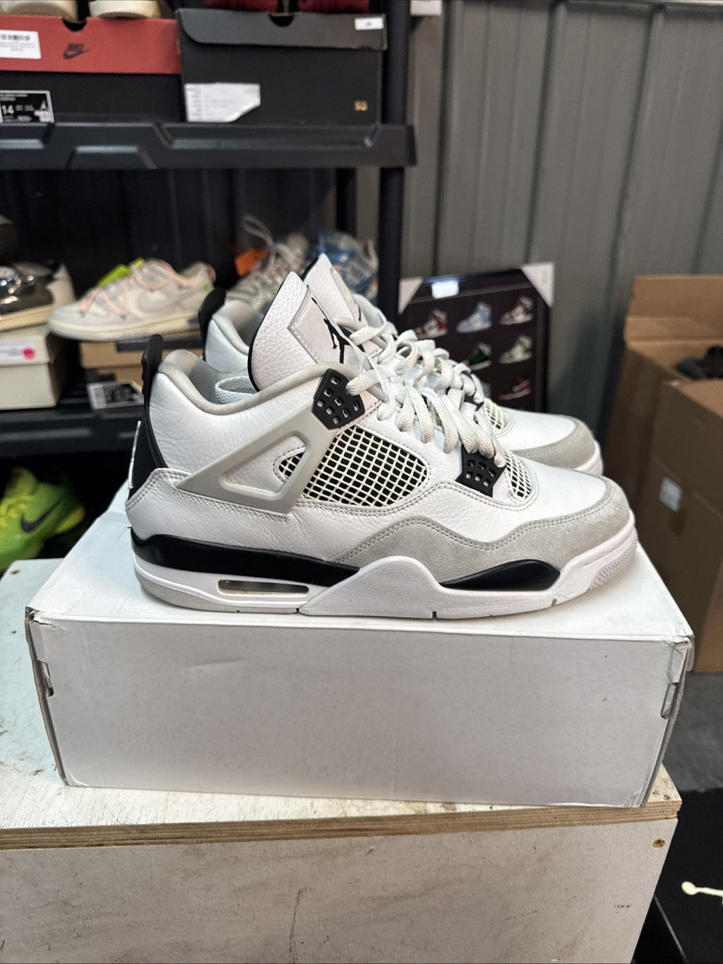 "Military Black" Size 10 - Jordan 4 Retro White and Black - product image from the listing.