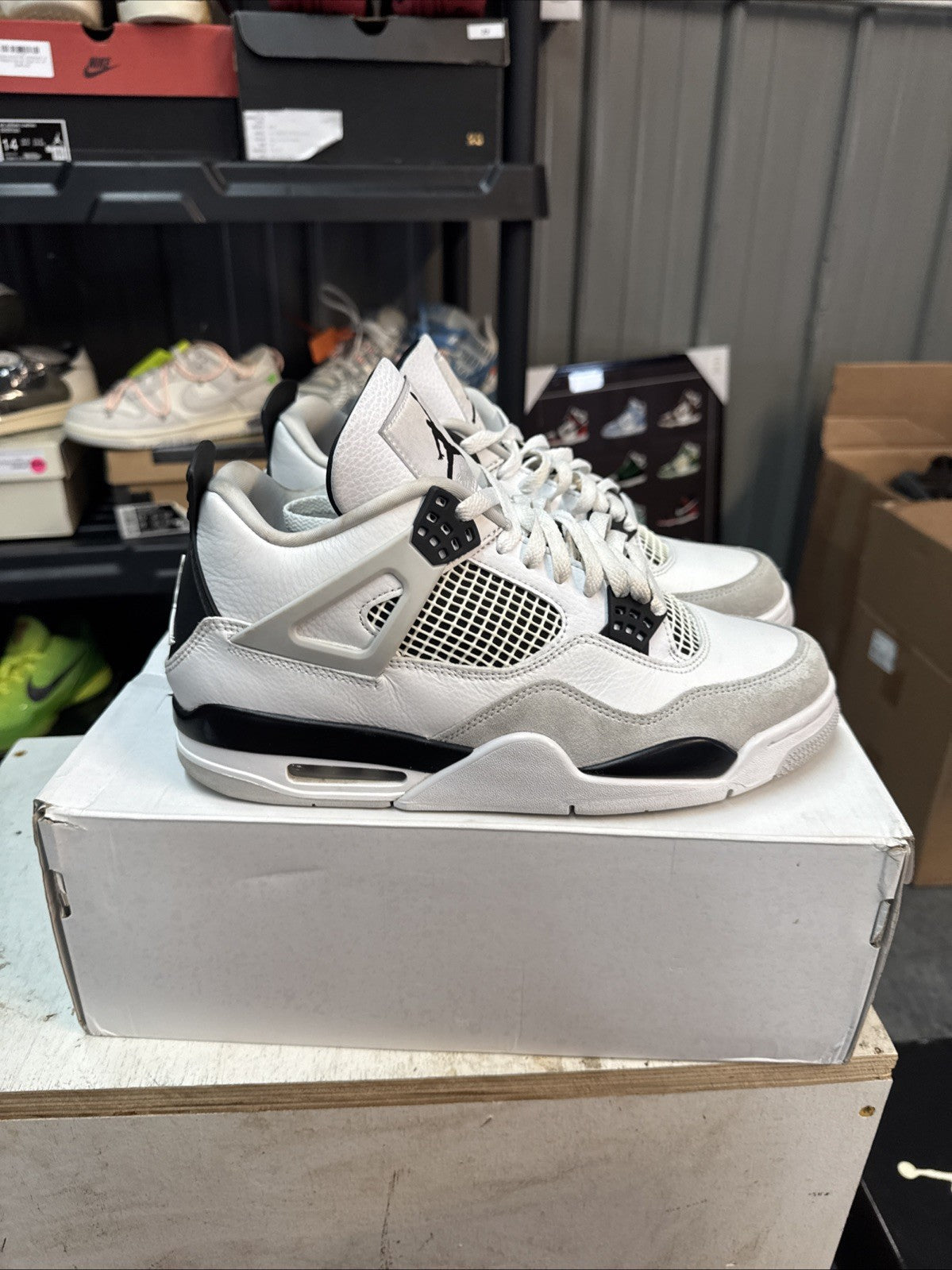 "Military Black" Size 10 - Jordan 4 Retro White and Black - product image from the listing.
