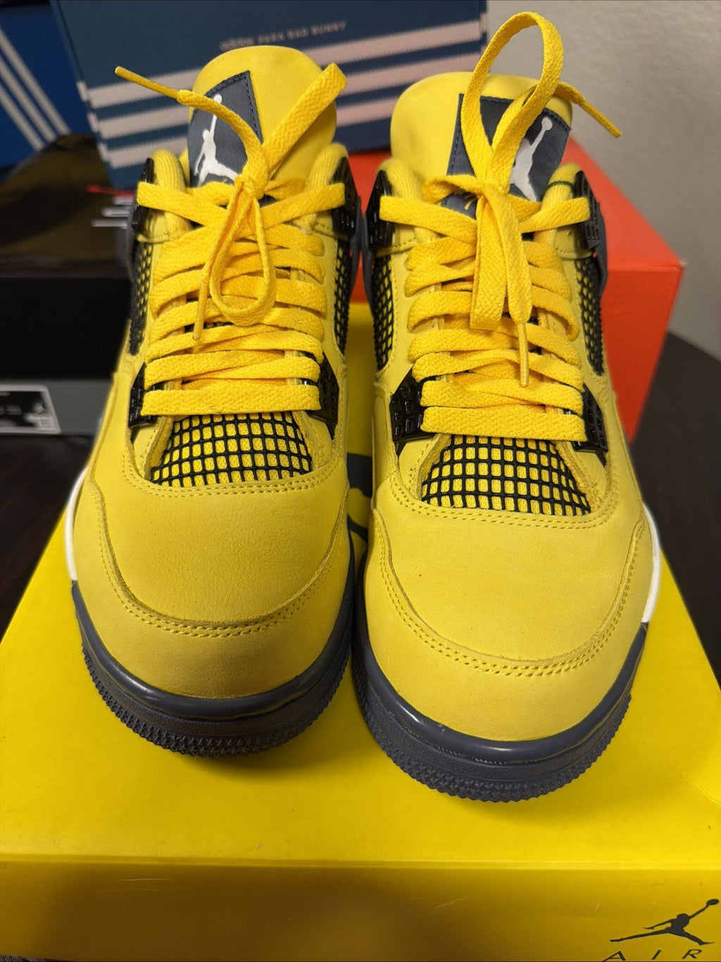 Air Jordan 4 Retro Tour Yellow/Dark in Blue Grey - product image from the listing.