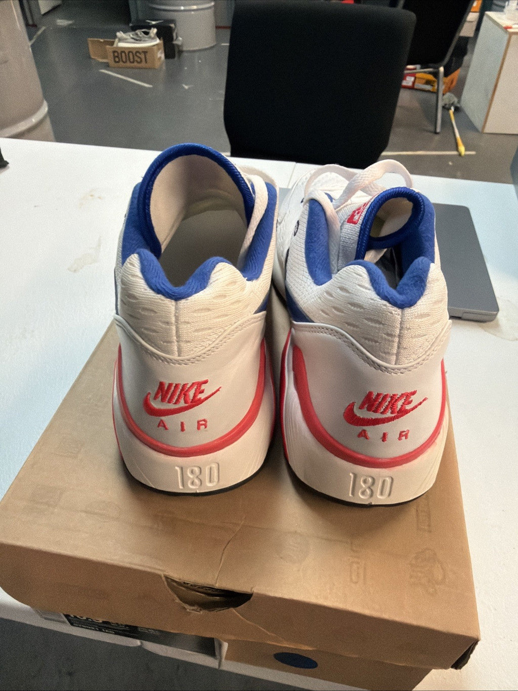 Size 10.5 Nike Air Max 180 EM White Solar in Red - product image from the listing.