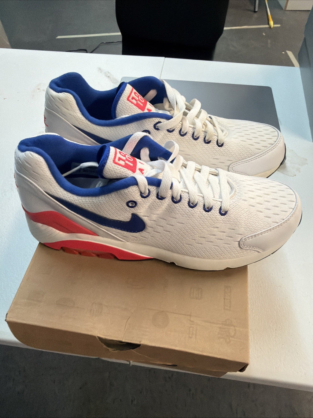 Size 10.5 Nike Air Max 180 EM White Solar in Red - product image from the listing.