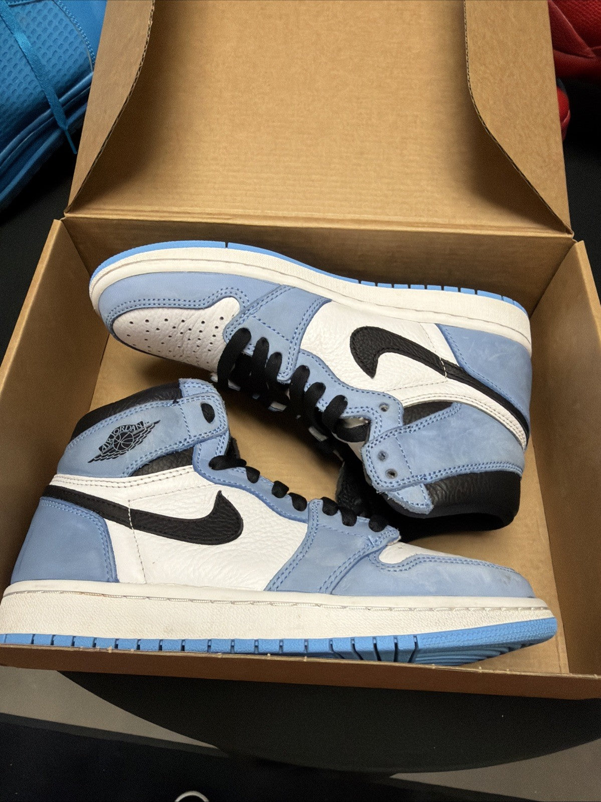 pair of Nike Air Jordan 1 Retro High OG Trainers in the "University Blue 6.5y - product image from the listing.