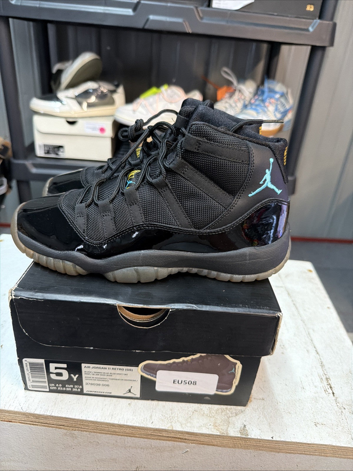 Air Jordan 11 Retro Gamma Blue Sneakers Black Patent in Leather - product image from the listing.
