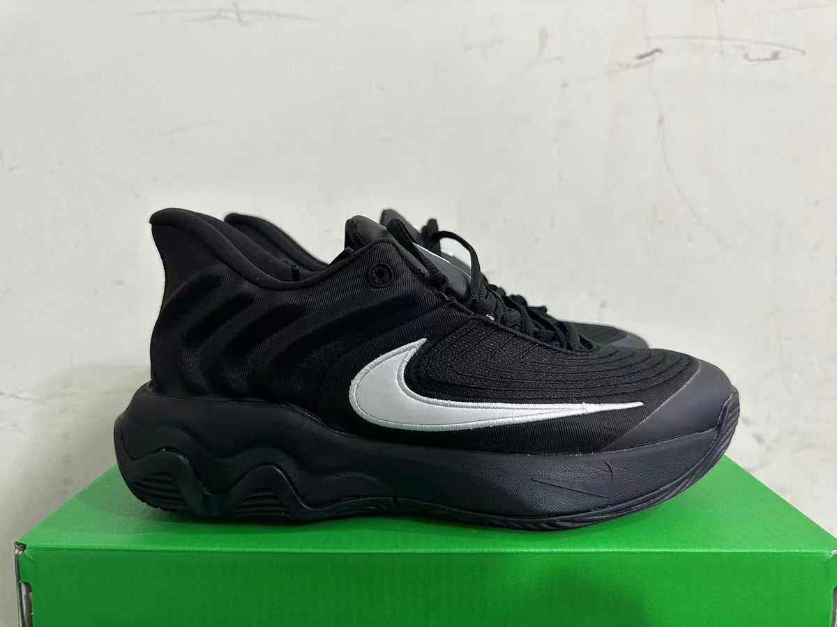 Nike Black Basketball Footwear with White Swoosh - product image from the listing.
