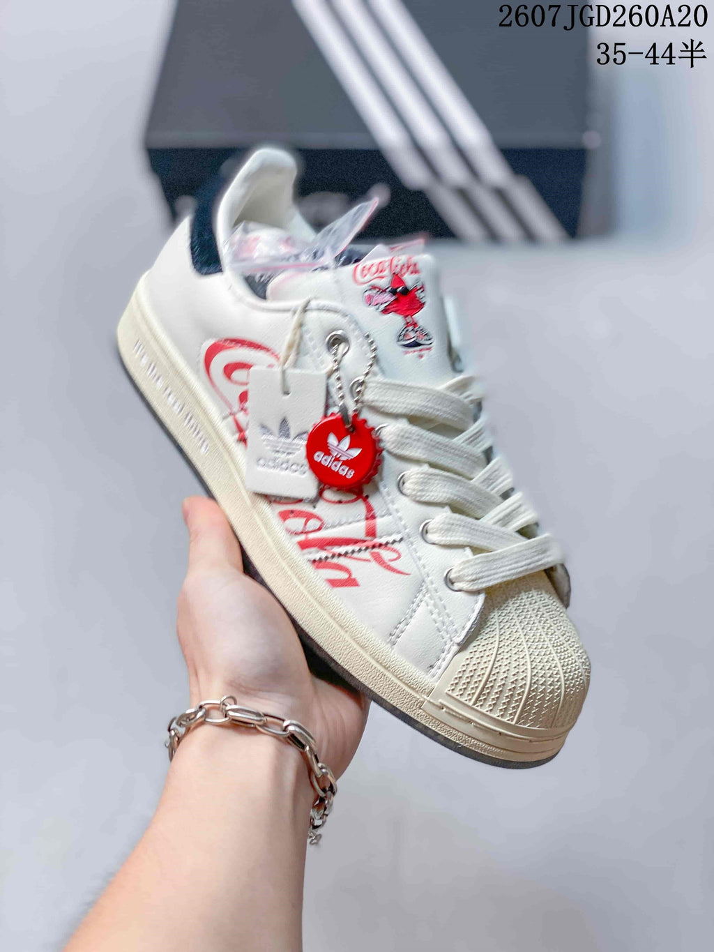 Adidas Superstar x Coca-Cola Low-Top Sneakers in White KH6892 - product image from the listing.