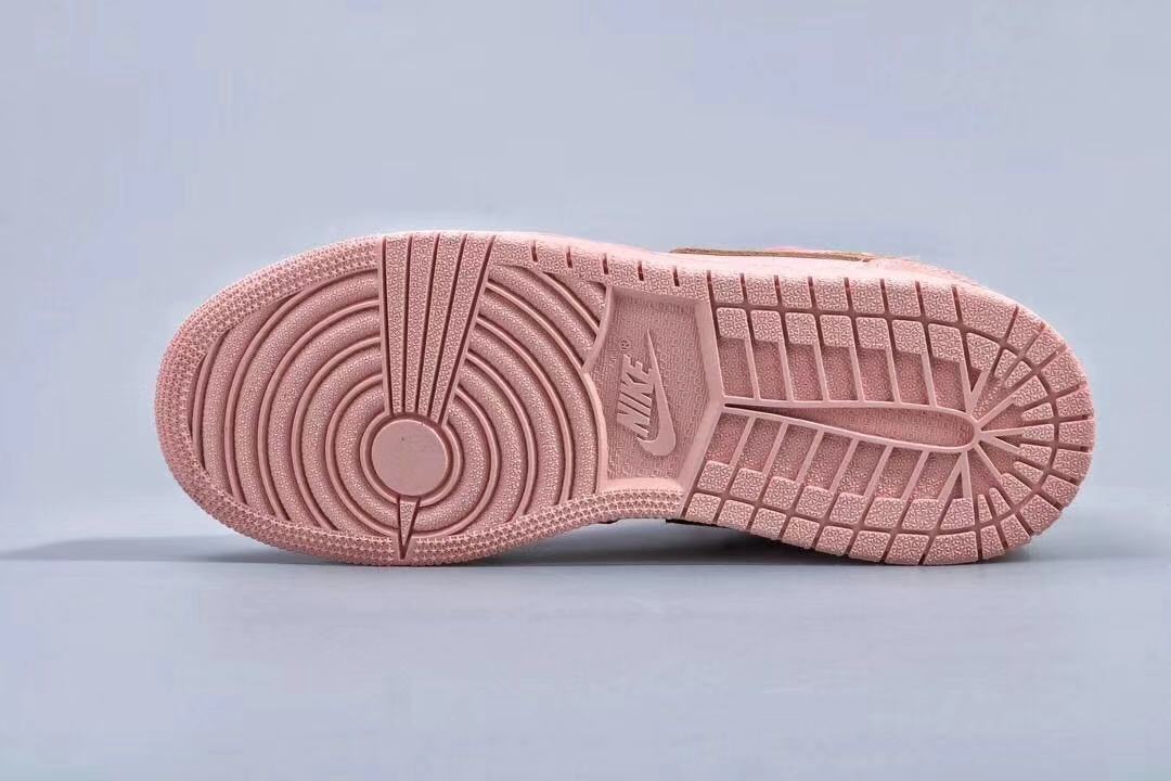 Women's Jordan 1 Low Pink and Gold Sneakers - product image from the listing.