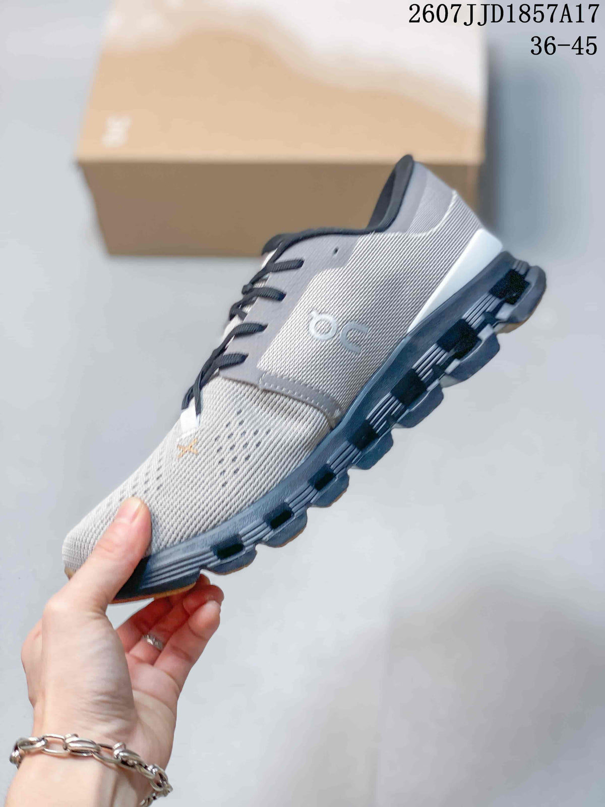 On Cloud X 4 Sneakers in Gray Black 2607JJD1857A17 - product image from the listing.