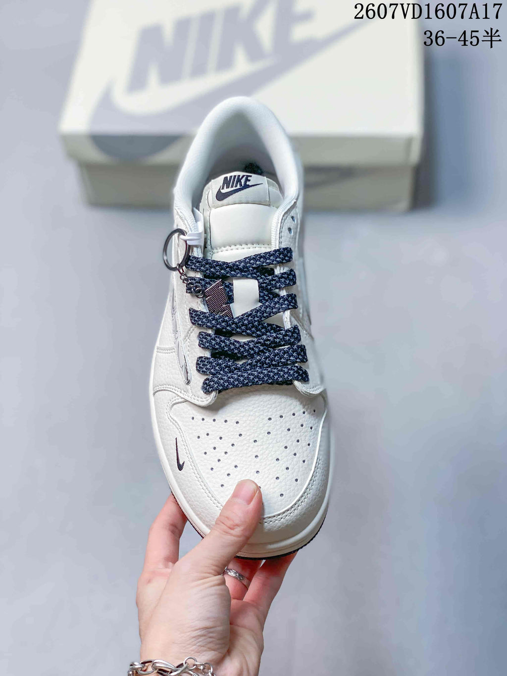 Travis Scott x Jordan 1 Low Sneakers in White Black 2607VD1607A17 - product image from the listing.