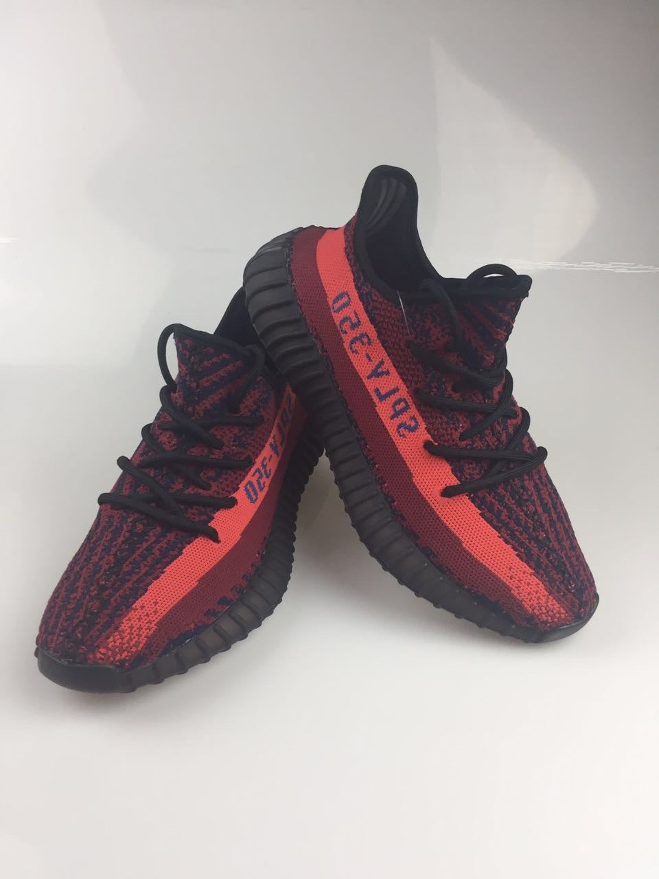 Adidas Yeezy Boost 350 V2 Sneakers in Black and Burgundy - product image from the listing.