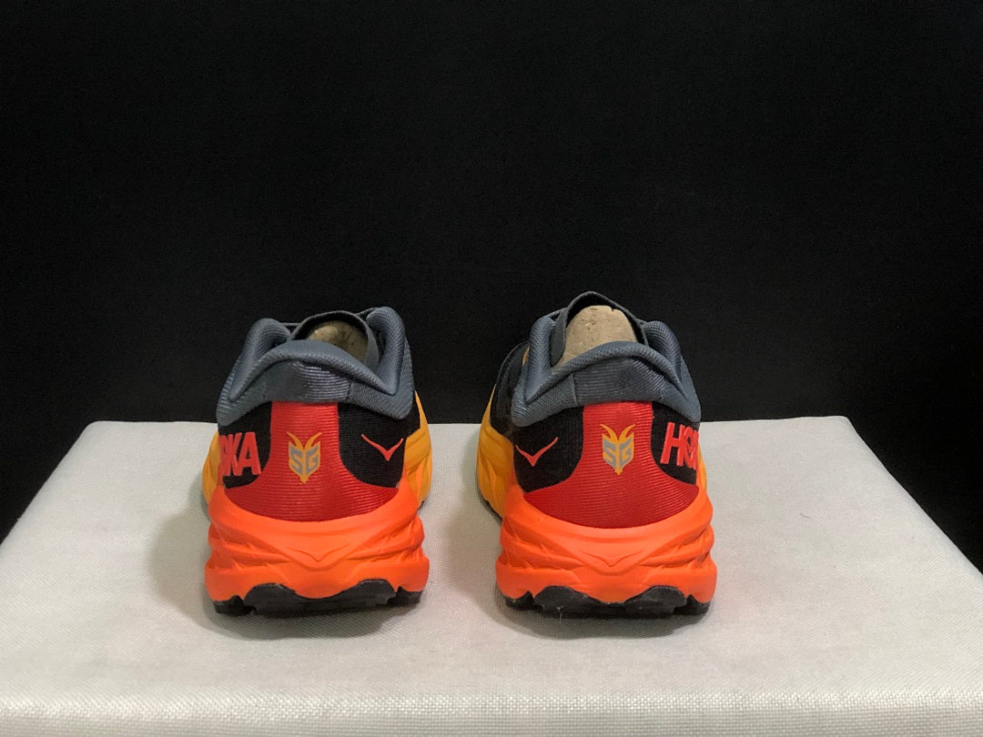 HOKA Speedgoat 5 Trail Running Shoes, in Gray and Orange - product image from the listing.