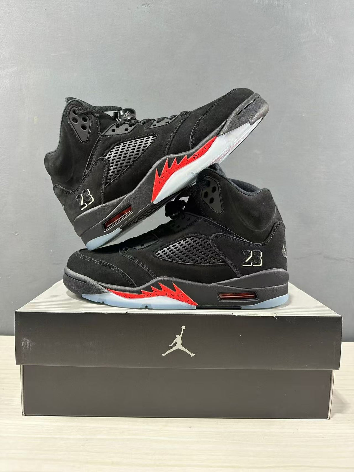 Air Jordan 5 Retro Sneakers Black and Red - product image from the listing.