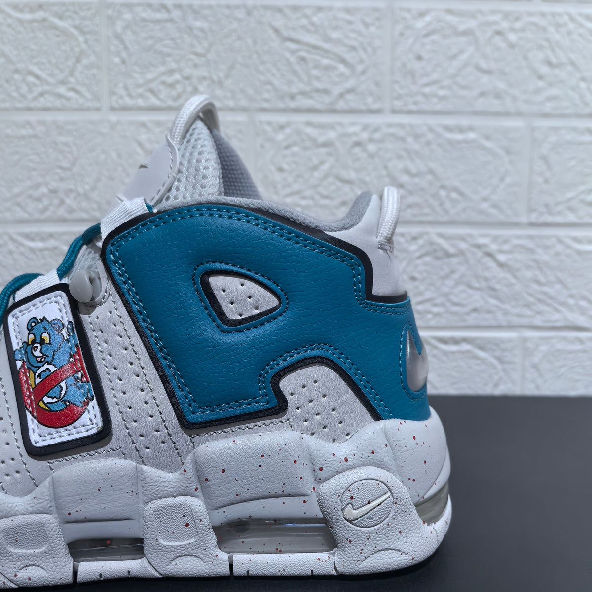 Nike Air More Uptempo Cartoon Bear Sneakers, in White Blue Red - product image from the listing.