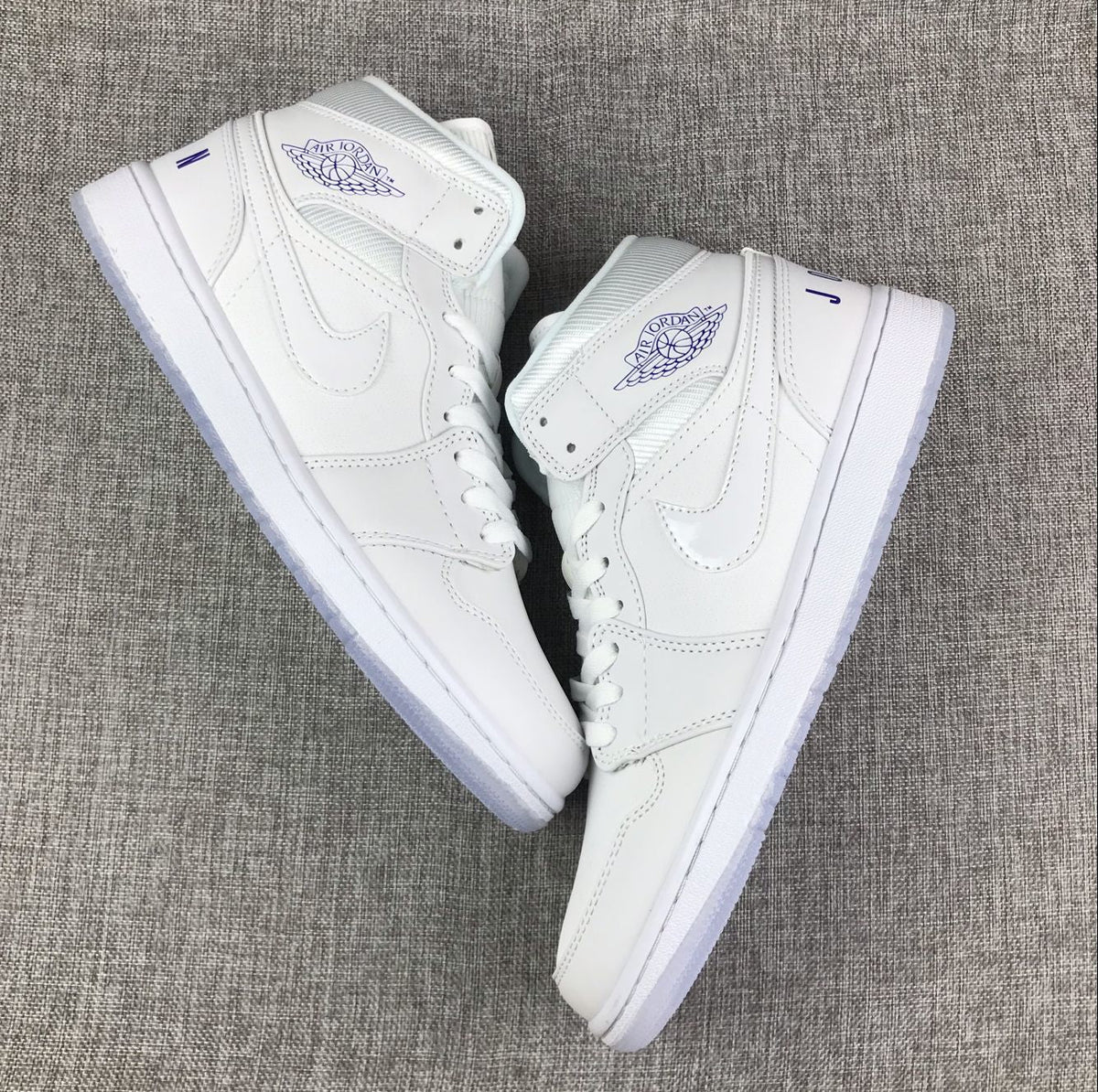 White Sneakers with Translucent Outsole - Air Jordan 1 Mid - product image from the listing.