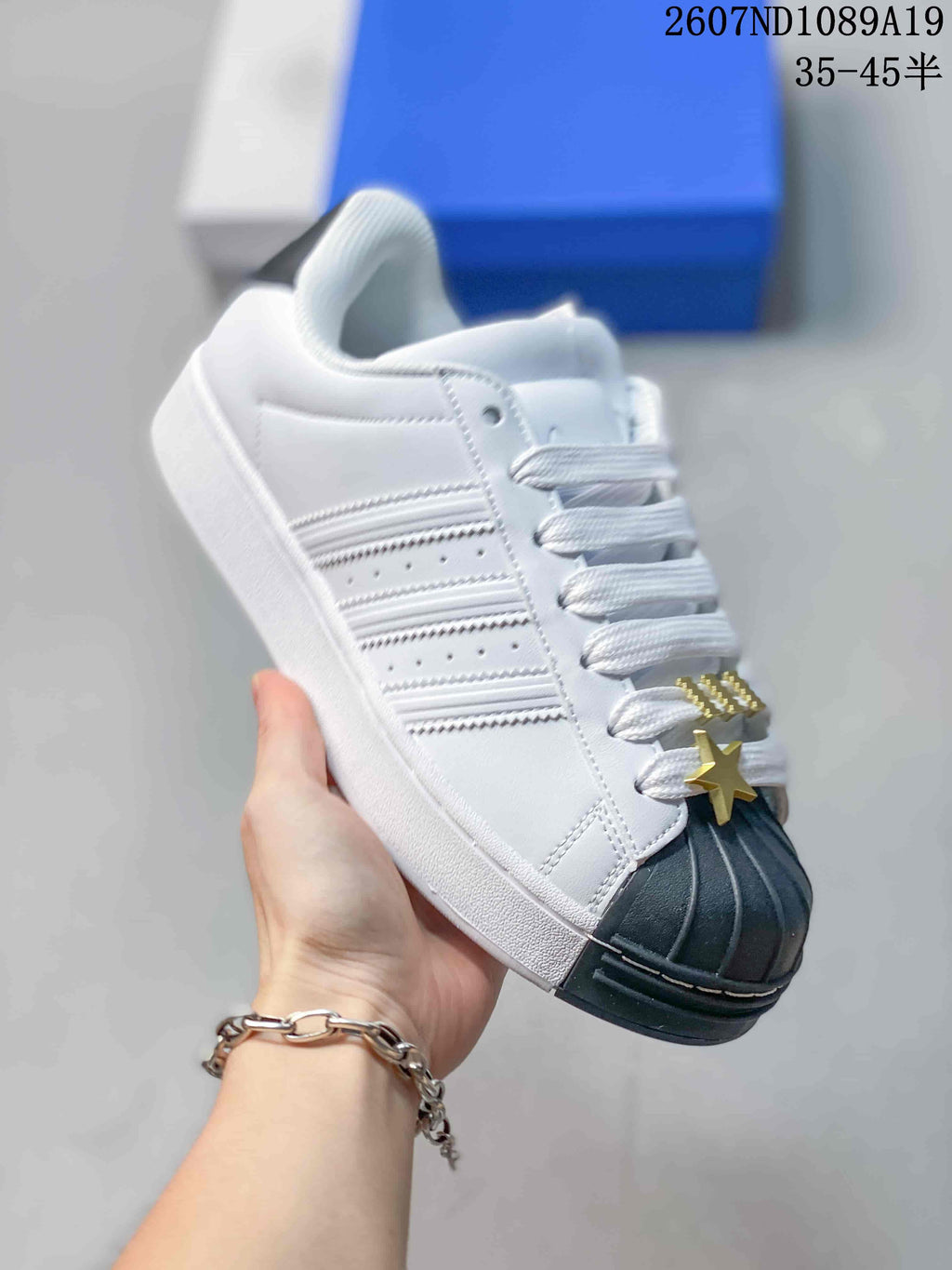 Adidas Superstar Sneakers in White Black Gold 2607ND1089A19 - product image from the listing.
