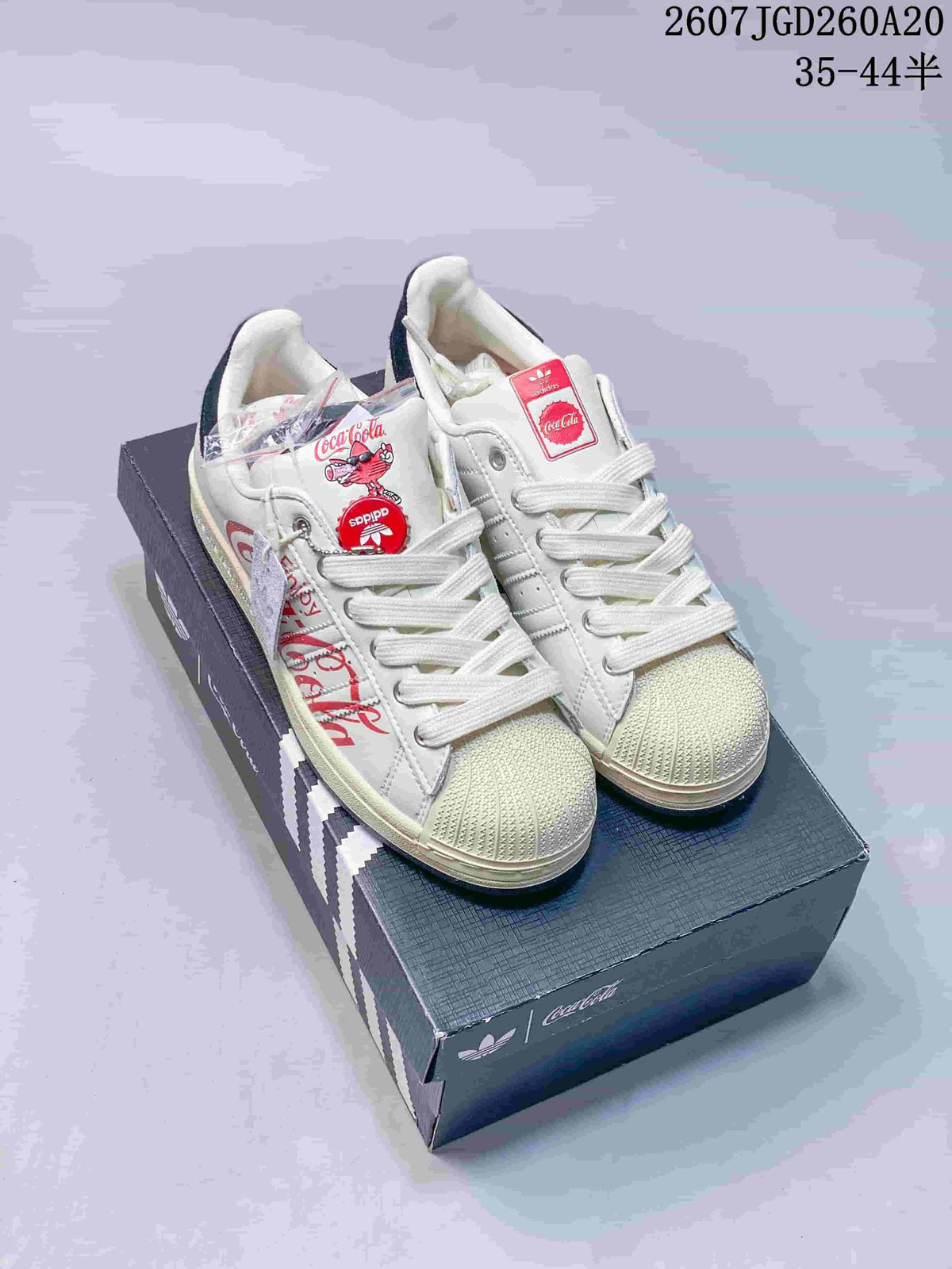 Adidas Superstar x Coca-Cola Low-Top Sneakers in White KH6892 - product image from the listing.