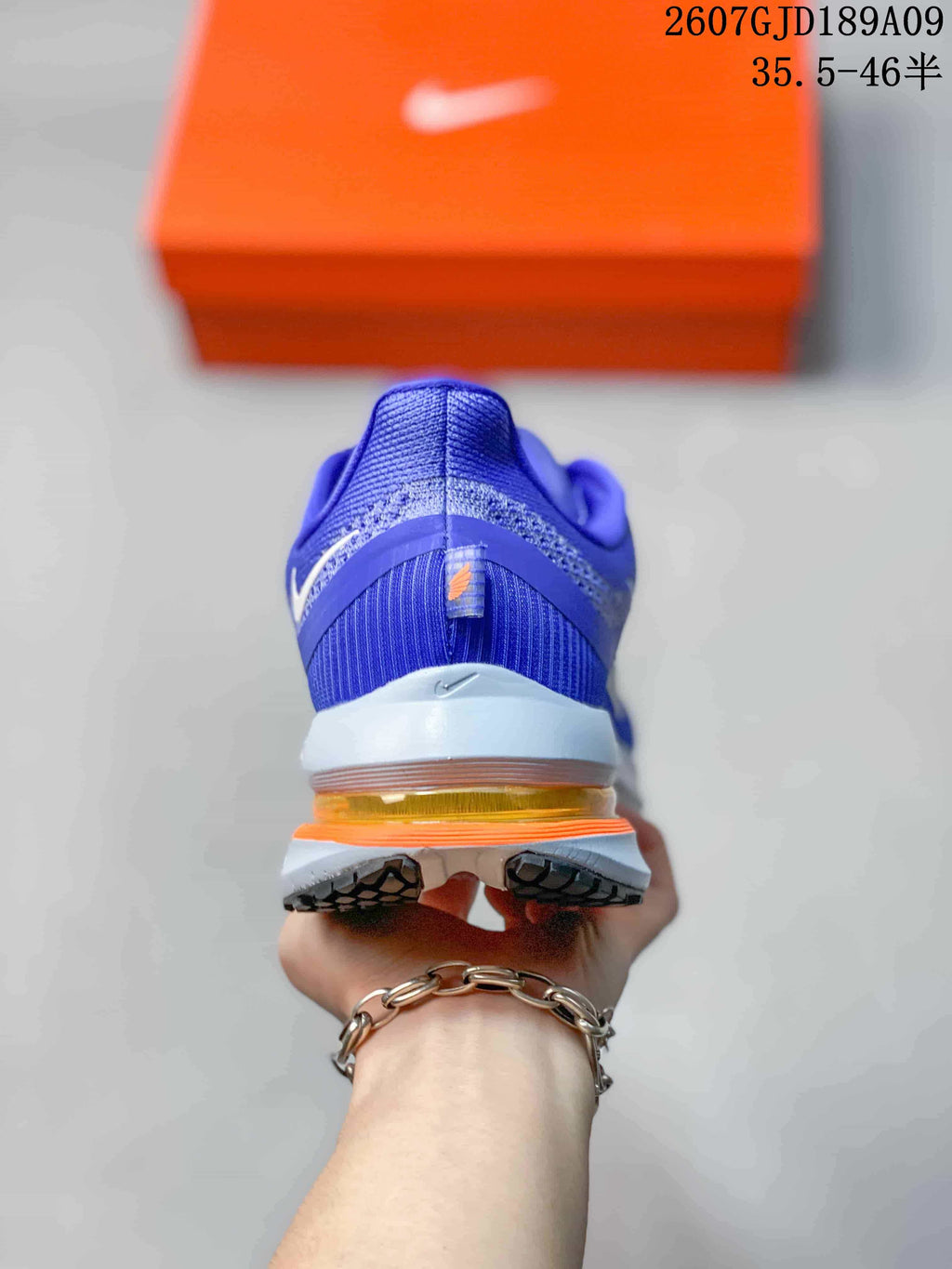 Nike Vomero Premium Running Shoes in Blue - product image from the listing.