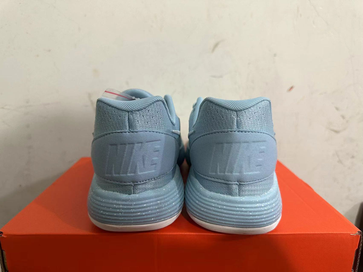 Nike Basketball Footwear in Blue with White Swoosh - product image from the listing.