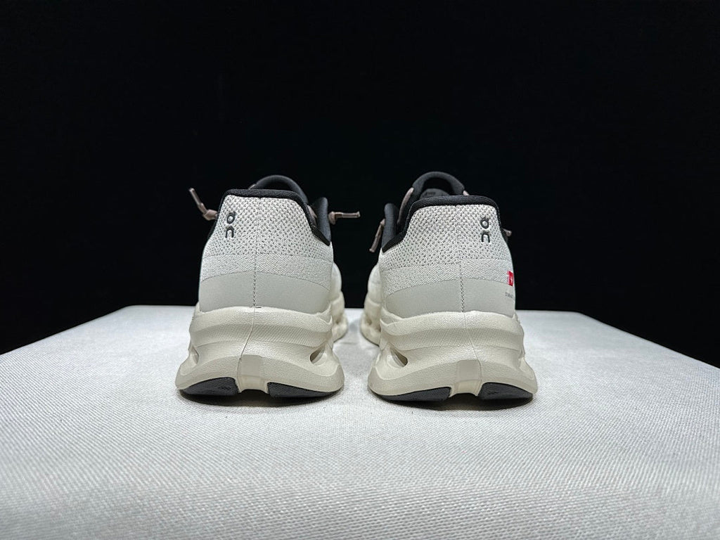 On Cloudtilt Sneakers, in Light Gray and Black - product image from the listing.