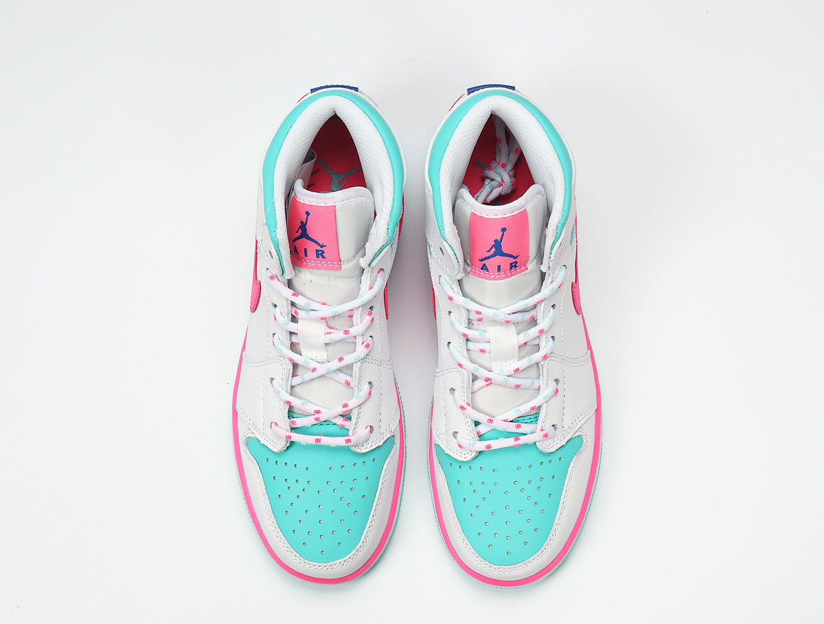 Jordan 1 Mid Sneakers in White Pink Turquoise 555112-102 - product image from the listing.