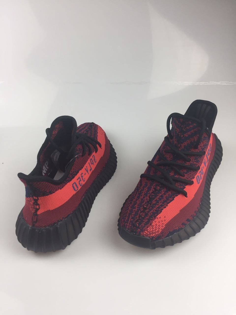 Adidas Yeezy Boost 350 V2 Sneakers in Black and Burgundy - product image from the listing.