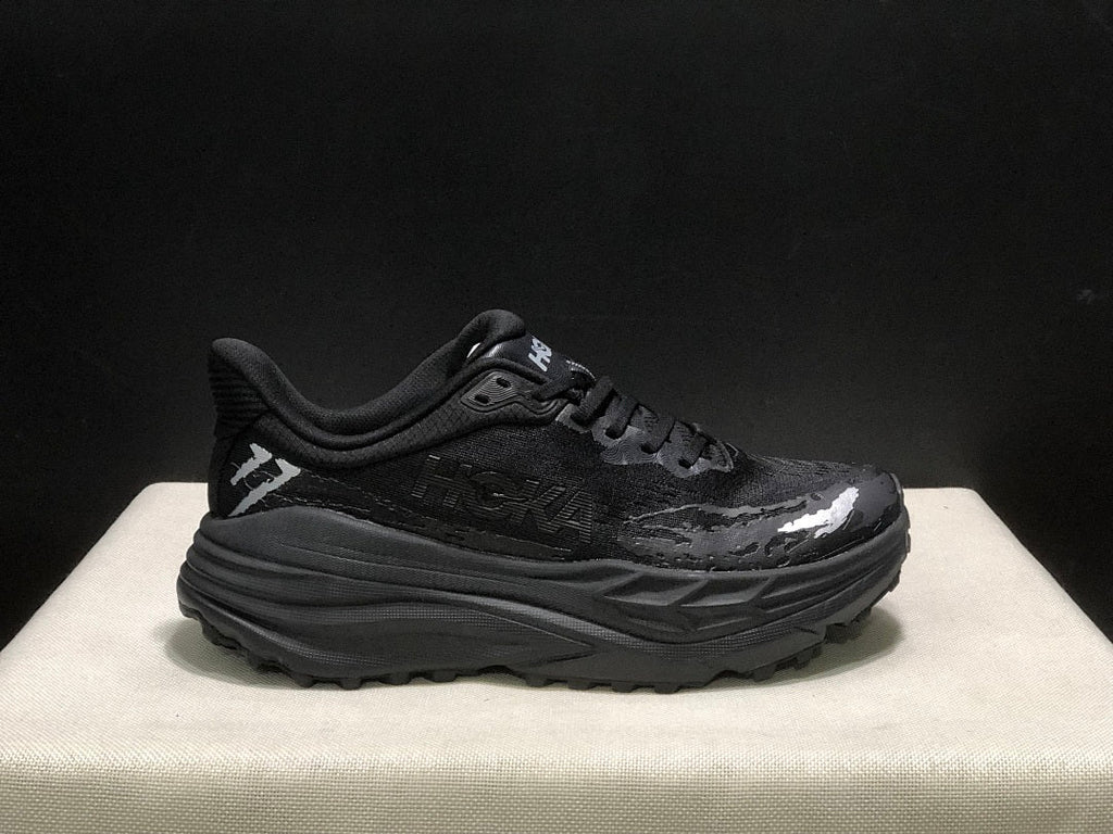 HOKA Stinson 7 Black Trail Trainers - product image from the listing.