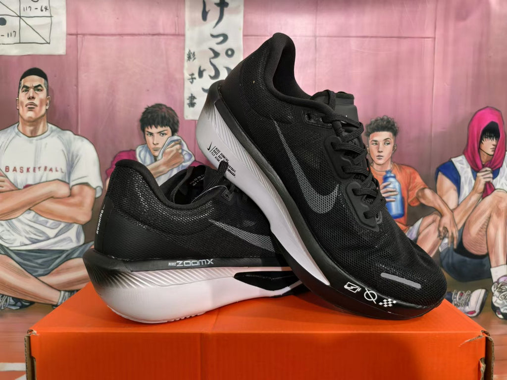 Nike ZoomX Running Shoes in Black and White - product image from the listing.