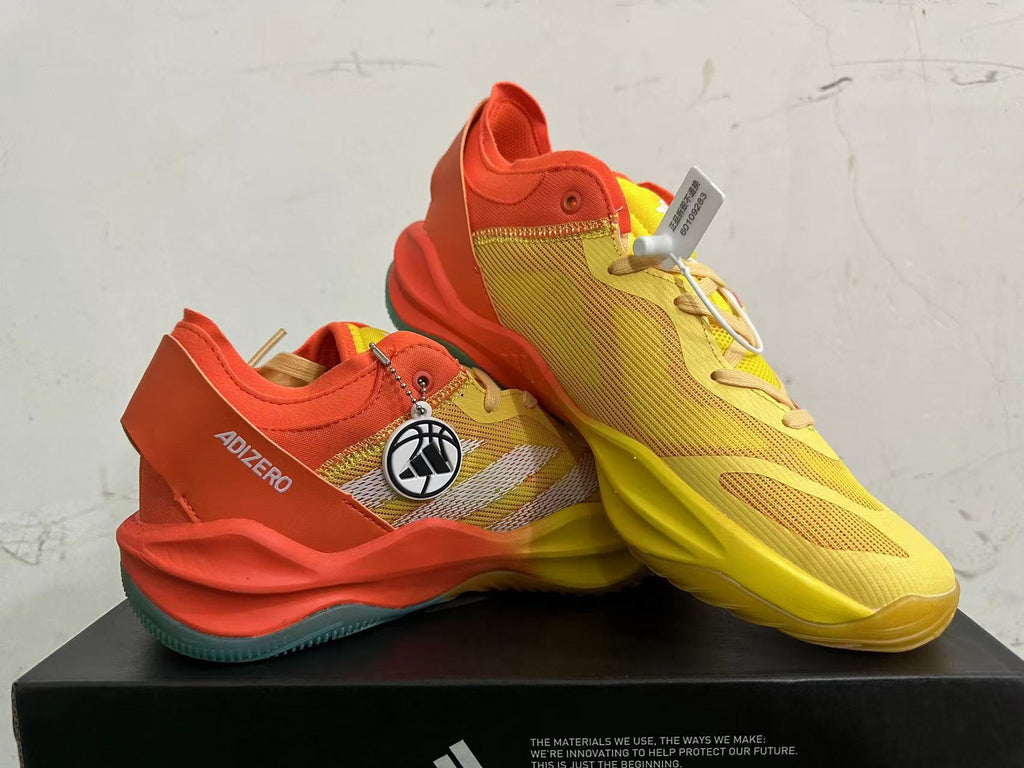 Adidas Adizero Basketball Shoes in Yellow Orange - product image from the listing.