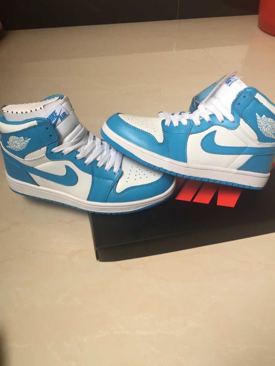 Jordan 1 High Sneakers in White and Blue - product image from the listing.