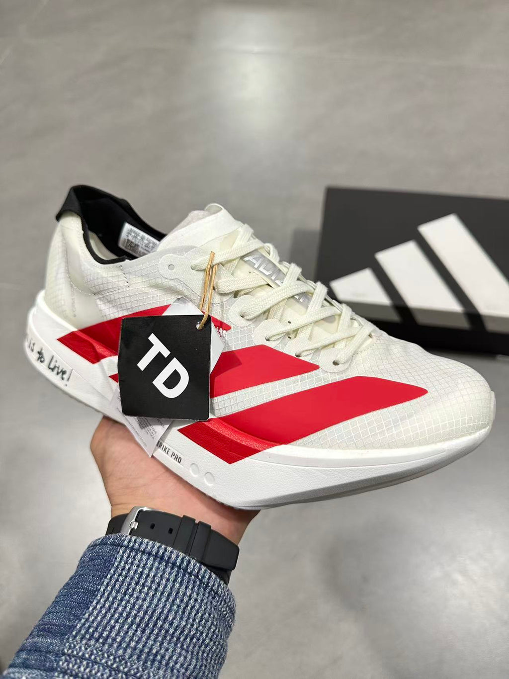 Nike Lightstrike Pro Running Sneakers in White and Red JR6363 - product image from the listing.